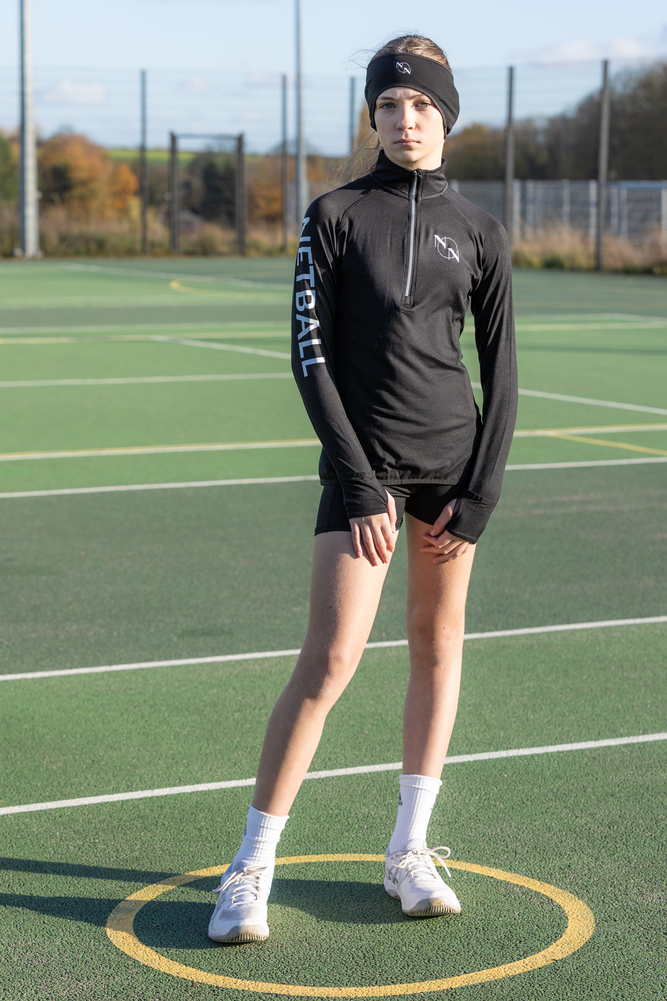 Ladies Black Long Sleeve Zip Neck Performance Top with 'Netball' Arm